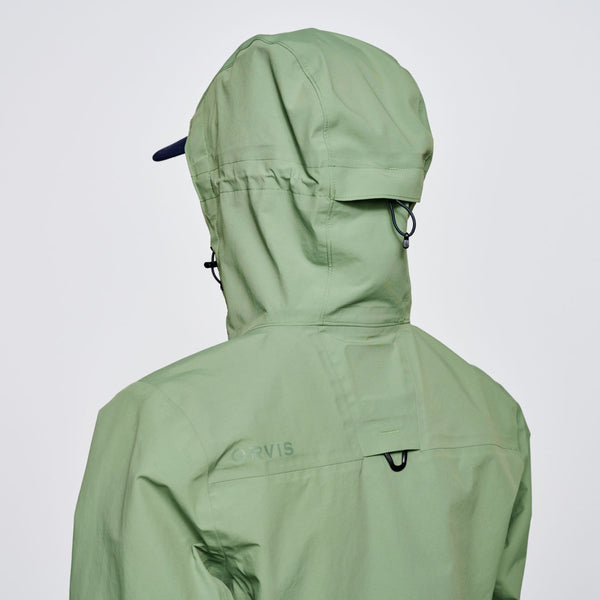 closeup of backside of hood on green waterproof jacket for women