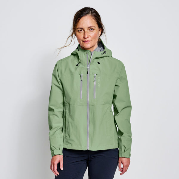 woman wearing lime green waterproof jacket
