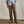 Load image into Gallery viewer, Person wearing brown pants and a plaid shirt on a wooden floor with a beige wall background
