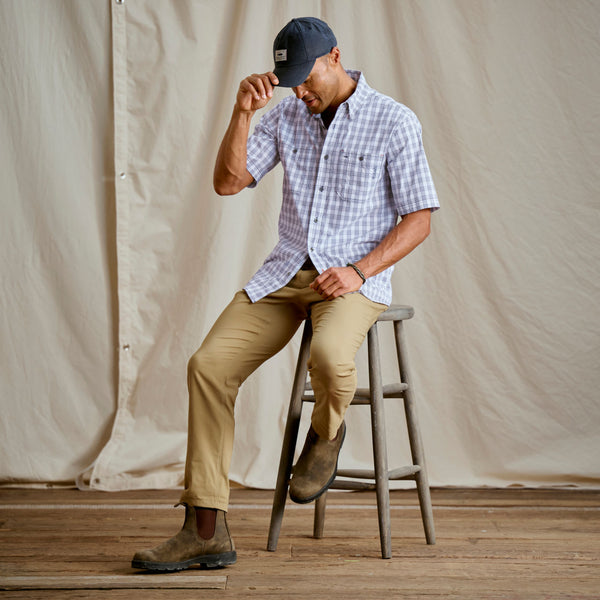 Man sat on wooden high chair