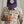Load image into Gallery viewer, Man wearing fly cap and white and beige checkered shirt in front of beige background
