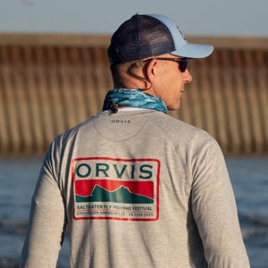 man wearing Orvis shirt facing away from camera