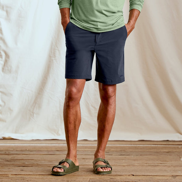 man wearing sandals and blue shorts