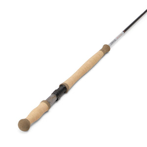 Fly fishing rod with cork handle on a white background