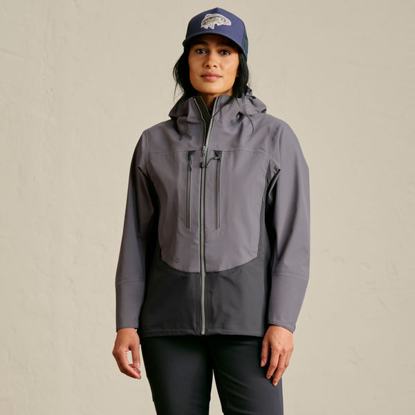 woman facing camera wearing dark blue fishing cap and dark grey fishing clothes
