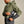 Load image into Gallery viewer, man closing side zipper on grey and reen waterproof jacket
