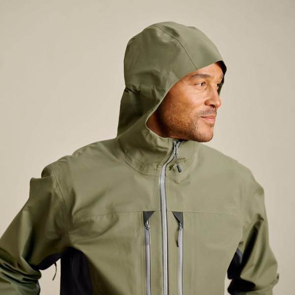 man wearing hood on waterproof jacket