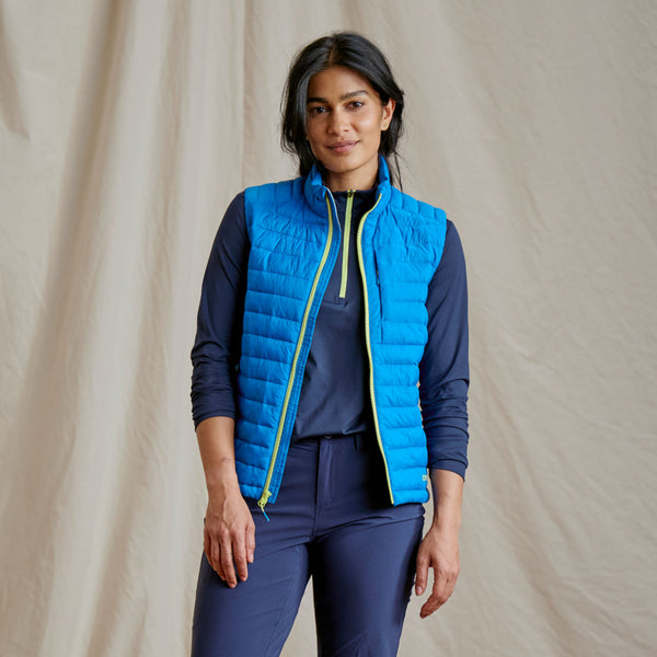 woman modelling light blue fishing vest with yellow zipper