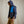 Load image into Gallery viewer, man wearing dark blue hoodie and blue gilet, beige pants
