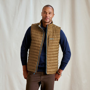 man wearing beige vest