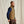Load image into Gallery viewer, man wearing blue jumper and beige vest
