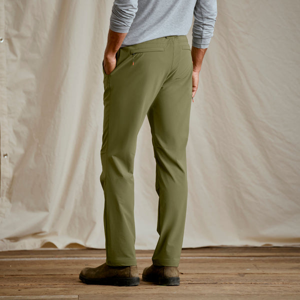 closeup of man wearing dark green trousers