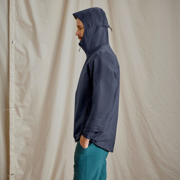 man modelling dark blue waterproof jacket
