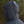 Load image into Gallery viewer, Person wearing a gray raincoat with hood in a natural setting
