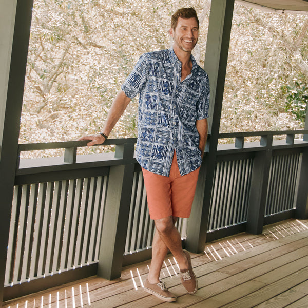 man on terrace smiling