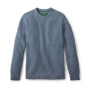 Blue knitted sweater on a white background
