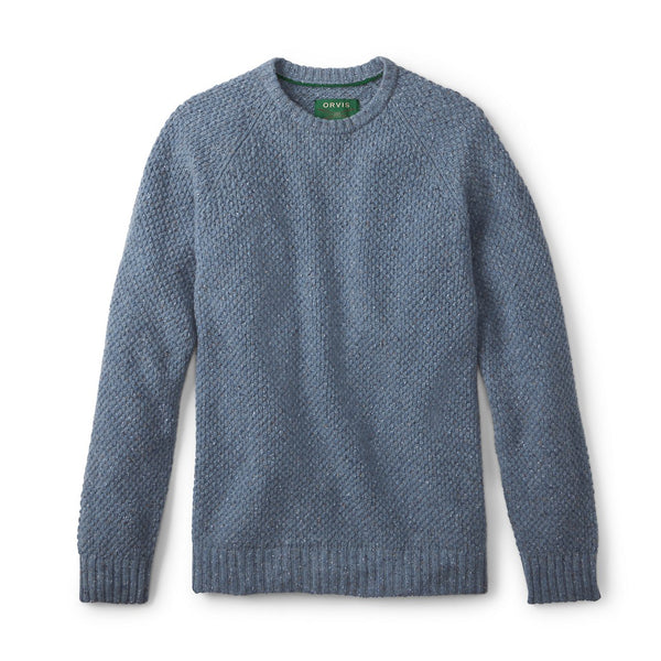 Blue knitted sweater on a white background