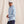 Load image into Gallery viewer, man in front of beige background wearing light blue jacket, blue pants and cap with fishing logo
