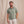 Load image into Gallery viewer, man with brown hair and beard smiling to the camera wearing green  poloshirt and white trousers
