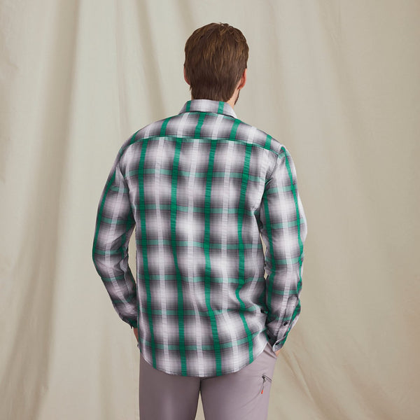 man wearing green and black shirt facing away of the camera