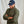 Load image into Gallery viewer, man wearing green jacket and blue cap
