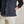 Load image into Gallery viewer, closeup of blue gilet with hand in pocket
