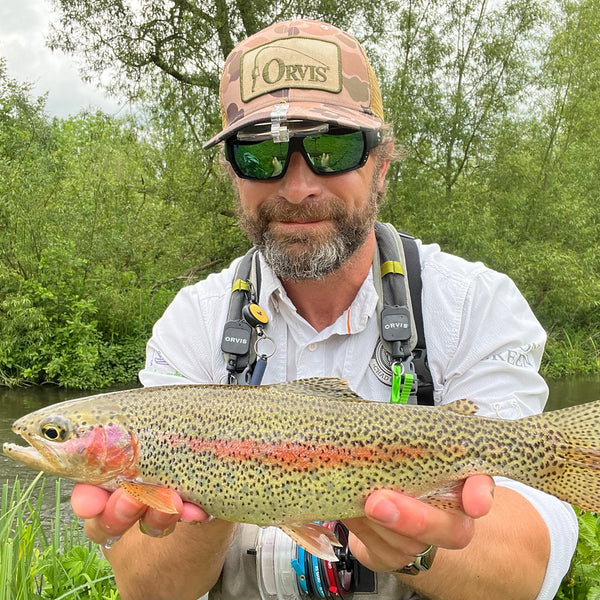 man showing fish to the camera