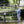 Load image into Gallery viewer, man showing child how to fly fish
