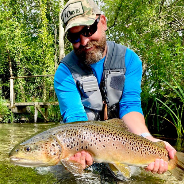 man showing off trout