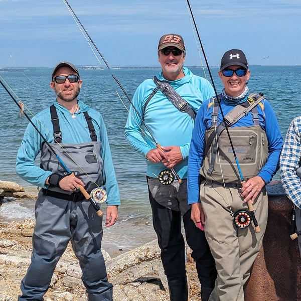 three men with fly rods and waders