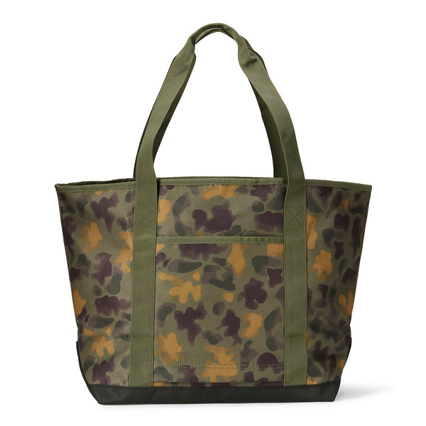 Camouflage tote bag with green handle on a white background