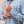 Load image into Gallery viewer, A close-up of a man wearing a light blue and white plaid long-sleeve button-down shirt, adjusting the cuff of the sleeve.
