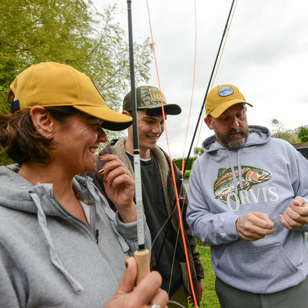 people learning fly fishing skills