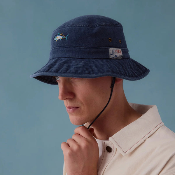 man wearing dark blue bucket hat