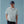 Load image into Gallery viewer, Man wearing dark blue cap with fishing logo, light blue short sleeved shirt standing in front of blue background
