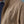 Load image into Gallery viewer, Close-up of a brown jacket with 'Fera' branding on a blue background
