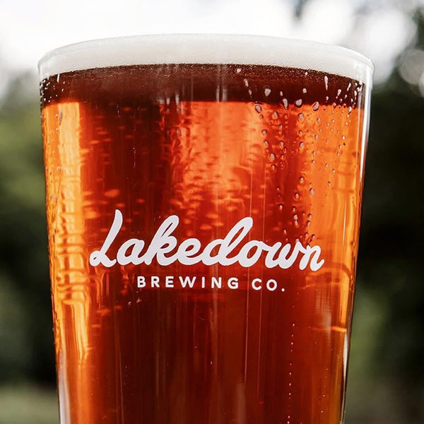 Glass of beer with lakedown breweing co. logo