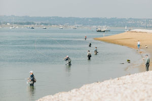 fly fishers wading in the water