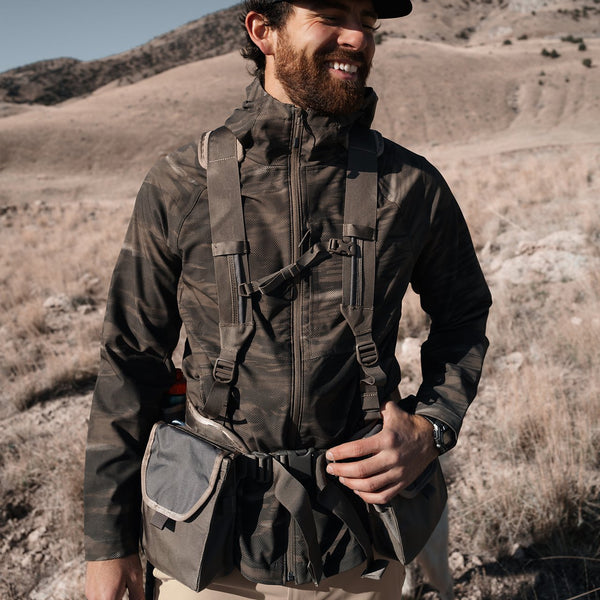 man on hill waering military jacket