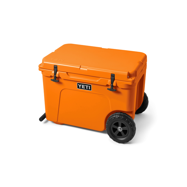 Orange YETI cooler with wheels on a white background