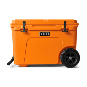 Orange YETI cooler with wheels on a white background