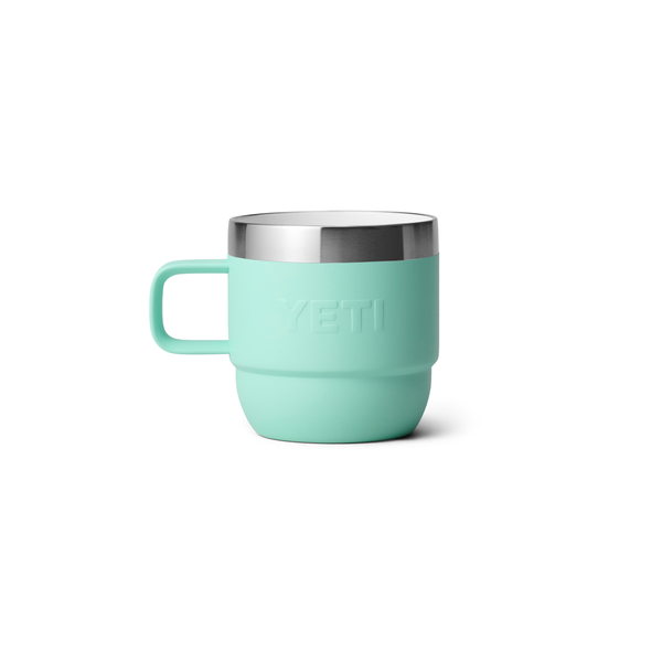 Light blue mug with silver rim on a white background