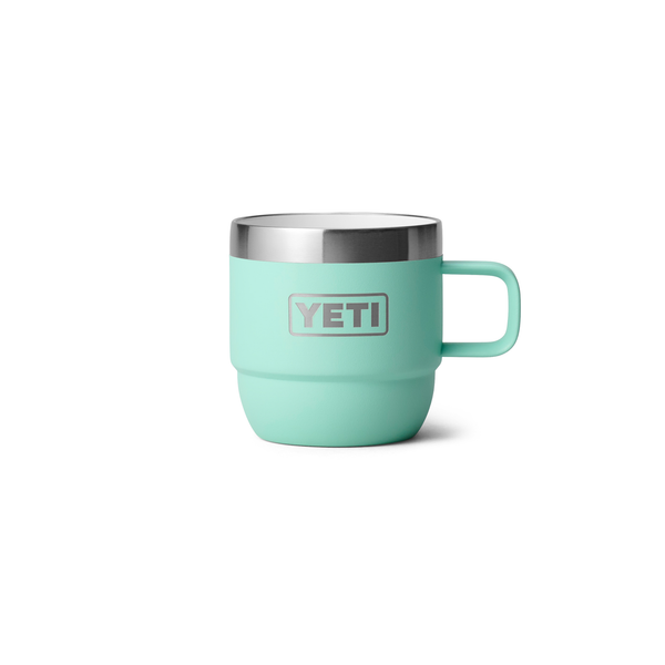 Mint green YETI mug with a silver rim on a white background
