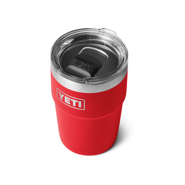 Red YETI tumbler with a clear lid on a white background