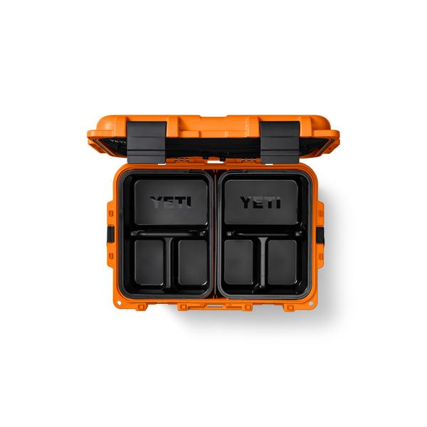 Orange YETI cooler with black interior compartments on a white background