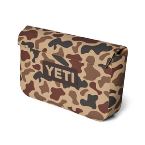 Camouflage-patterned YETI cooler bag on a white background