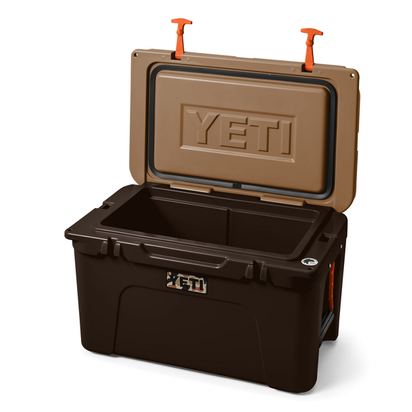 Brown YETI cooler with open lid on a white background