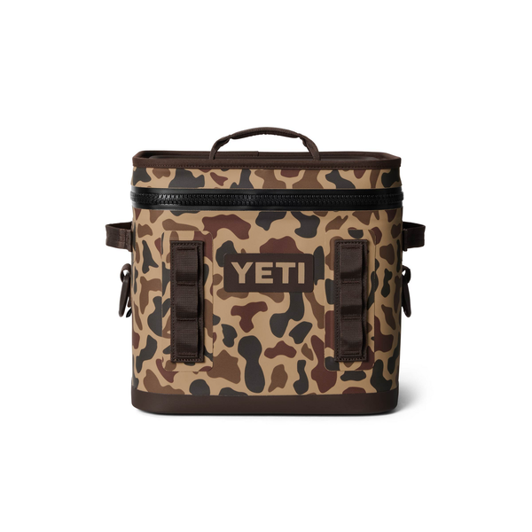 Camouflage-patterned cooler bag with YETI logo on a white background