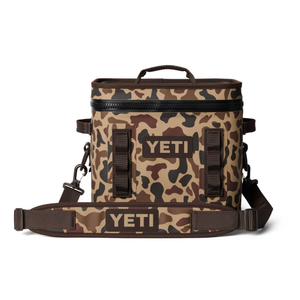 Camouflage-patterned YETI cooler bag on a white background
