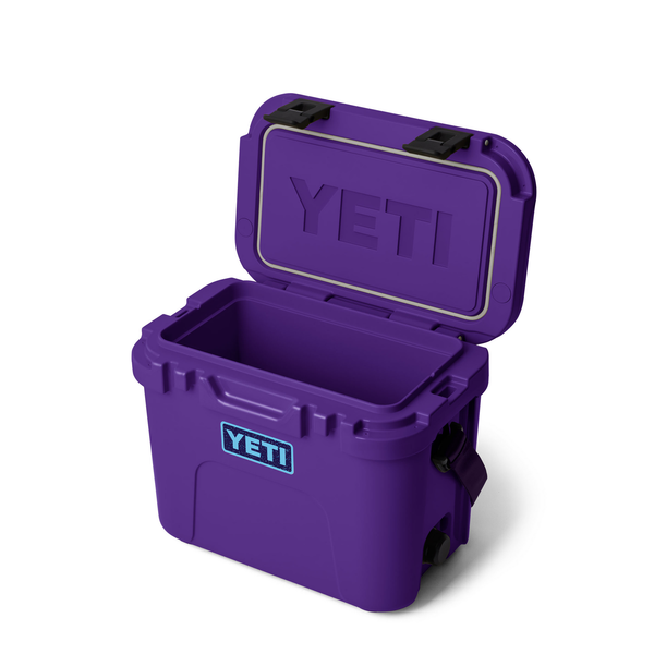 Purple Yeti hard cooler with open lid on white background